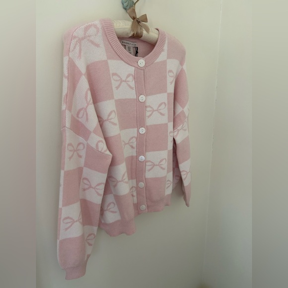 Sincerely Jules Baby Pink and White Knit Bow Cardigan
Size: Small
NWT - Picture 9 of 15